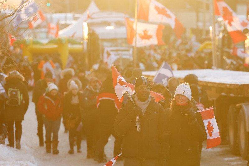HEALTH-CORONAVIRUS/CANADA-TRUCKING Demonstrators have a dance party in the street outside the Rideau Centre as truckers and supporters continue to protest coronavirus disease (COVID-19) vaccine mandates, in Ottawa, Ontario, Canada, February 5, 2022. REUTERS/Blair Gable