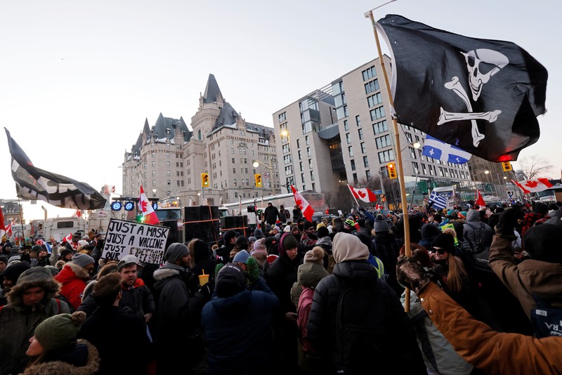 Demonstrators have a dance party in the street outside the Rideau Centre as truckers and supporters continue to protest coronavirus disease (COVID-19) vaccine mandates, in Ottawa, Ontario, Canada, February 5, 2022. REUTERS/Blair Gable