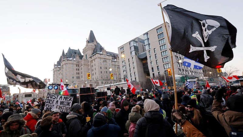 Demonstrators have a dance party in the street outside the Rideau Centre as truckers and supporters continue to protest coronavirus disease (COVID-19) vaccine mandates, in Ottawa, Ontario, Canada, February 5, 2022. REUTERS/Blair Gable