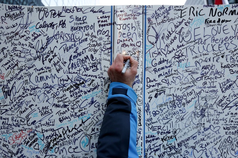 HEALTH-CORONAVIRUS/CANADA-TRUCKING Demonstrators have a dance party in the street outside the Rideau Centre as truckers and supporters continue to protest coronavirus disease (COVID-19) vaccine mandates, in Ottawa, Ontario, Canada, February 5, 2022. REUTERS/Blair Gable