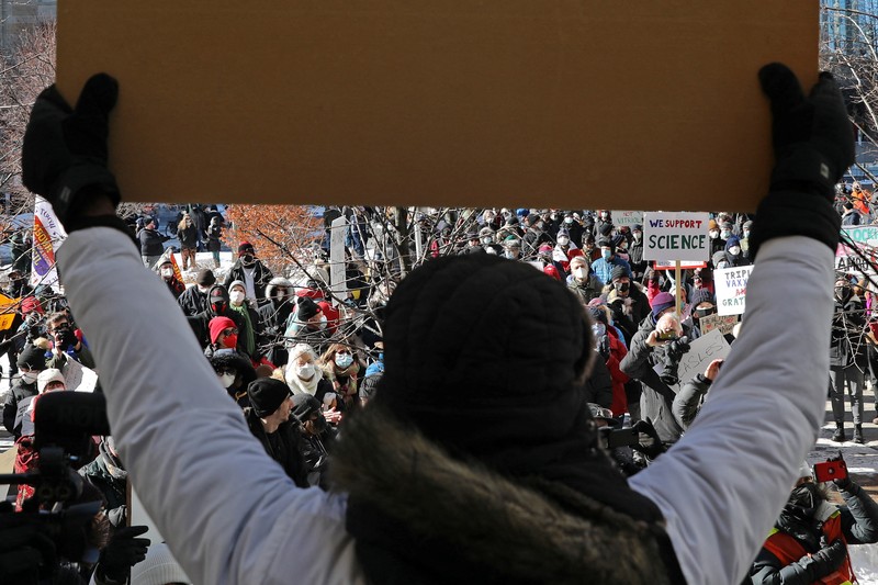 Demonstrators have a dance party in the street outside the Rideau Centre as truckers and supporters continue to protest coronavirus disease (COVID-19) vaccine mandates, in Ottawa, Ontario, Canada, February 5, 2022. REUTERS/Blair Gable