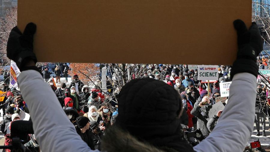 Demonstrators have a dance party in the street outside the Rideau Centre as truckers and supporters continue to protest coronavirus disease (COVID-19) vaccine mandates, in Ottawa, Ontario, Canada, February 5, 2022. REUTERS/Blair Gable