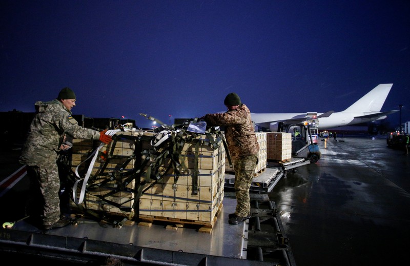 Military aid, delivered as part of the United States' security assistance to Ukraine, is unloaded from a plane at the Boryspil International Airport outside Kyiv, Ukraine, February 5, 2022. REUTERS/Valentyn Ogirenko