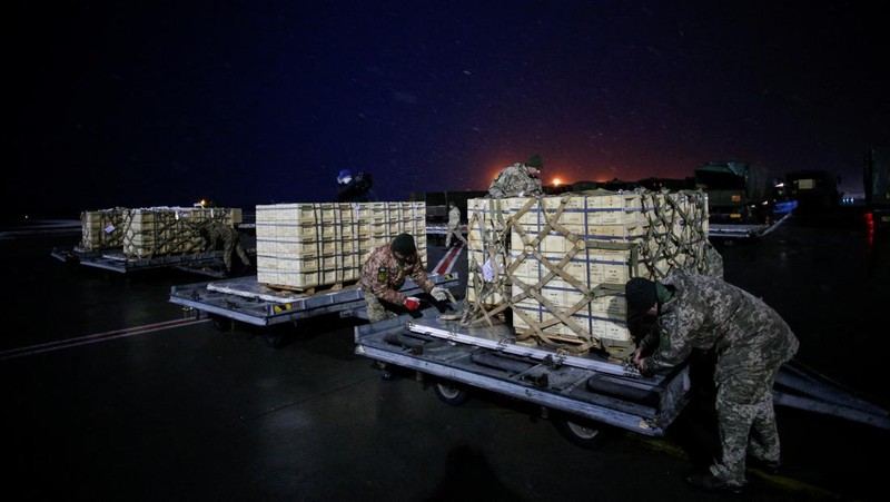 Military aid, delivered as part of the United States' security assistance to Ukraine, is unloaded from a plane at the Boryspil International Airport outside Kyiv, Ukraine, February 5, 2022. REUTERS/Valentyn Ogirenko