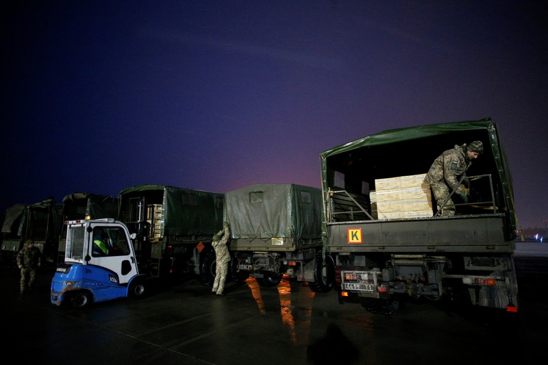 Military aid, delivered as part of the United States' security assistance to Ukraine, is unloaded from a plane at the Boryspil International Airport outside Kyiv, Ukraine, February 5, 2022. REUTERS/Valentyn Ogirenko