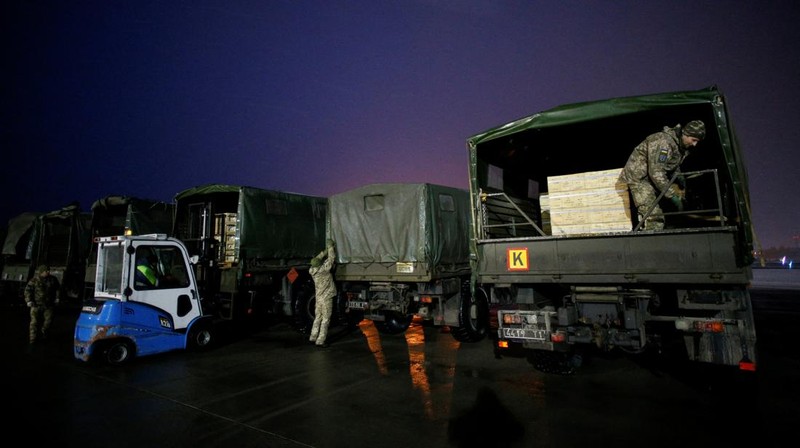 Military aid, delivered as part of the United States' security assistance to Ukraine, is unloaded from a plane at the Boryspil International Airport outside Kyiv, Ukraine, February 5, 2022. REUTERS/Valentyn Ogirenko