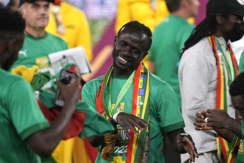 APTOPIX Cameroon African Cup Soccer Senegal's players celebrate with trophy after winning the African Cup of Nations 2022 final soccer match between Senegal and Egypt at the Ahmadou Ahidjo stadium in Yaounde, Cameroon, Sunday, Feb. 6, 2022. (AP Photo/Sunday Alamba)
