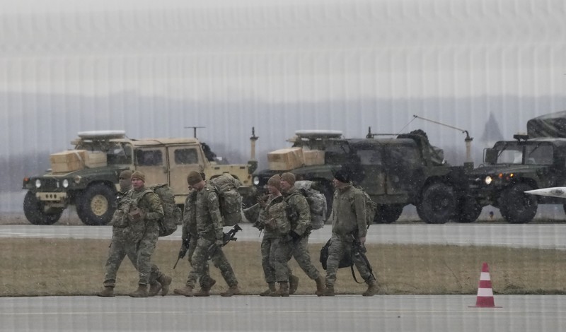 Poland Ukraine Tensions U.S. Army troops of the 82nd Airborne Division unloading vehicles from a transport plane after arriving from Fort Bragg at the Rzeszow-Jasionka airport in southeastern Poland, on Sunday, Feb. 6, 2022. Additional U.S. troops are arriving in Poland after President Joe Biden ordered the deployment of 1,700 soldiers here amid fears of a Russian invasion of Ukraine. Some 4,000 U.S. troops have been stationed in Poland since 2017. (AP Photo/Czarek Sokolowski)