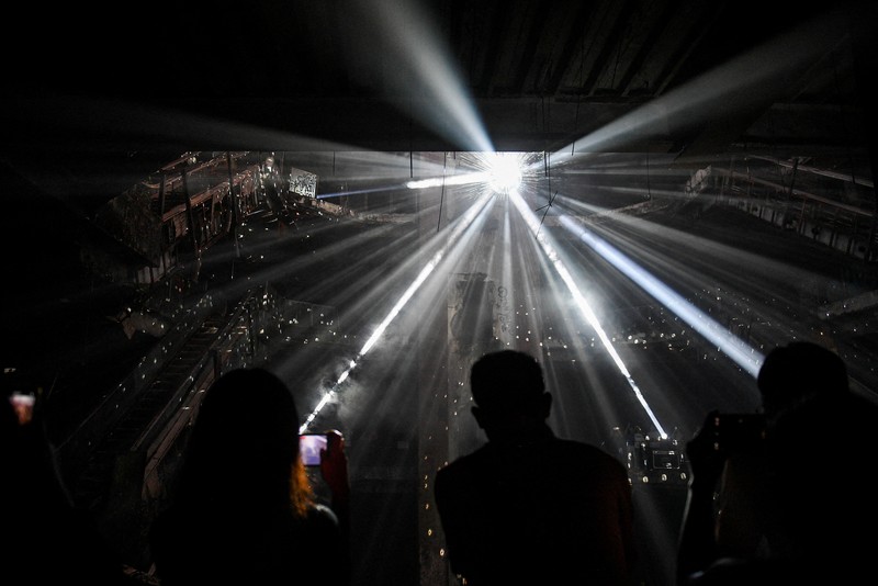 Local people visit a light installation exhibition to promote tourism at an abandoned New World department store in Bang Lamphu district, Bangkok Thailand February 6, 2022. REUTERS/Chalinee Thirasupa