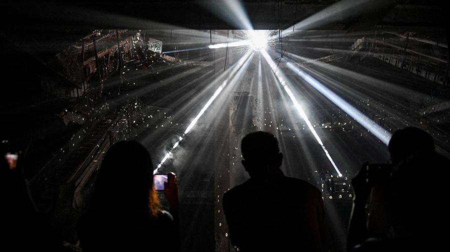 Local people visit a light installation exhibition to promote tourism at an abandoned New World department store in Bang Lamphu district, Bangkok Thailand February 6, 2022. REUTERS/Chalinee Thirasupa
