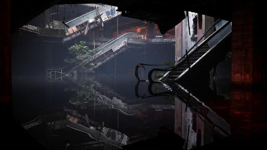 Local people visit a light installation exhibition to promote tourism at an abandoned New World department store in Bang Lamphu district, Bangkok Thailand February 6, 2022. REUTERS/Chalinee Thirasupa