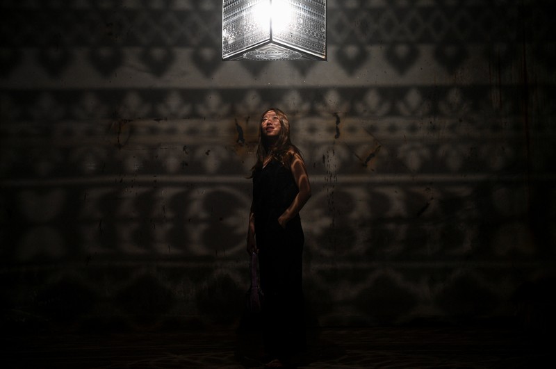 THAILAND-TOURISM/ Local people visit a light installation exhibition to promote tourism at an abandoned New World department store in Bang Lamphu district, Bangkok Thailand February 6, 2022. REUTERS/Chalinee Thirasupa