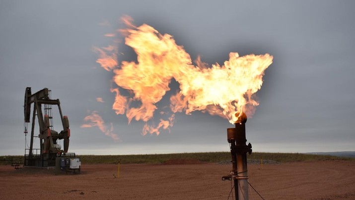 Global Energy Crunch FILE - In this Aug. 26, 2021 file photo, a flare burns natural gas at an oil well Aug. 26, 2021, in Watford City, N.D. The world's facing an energy crunch. Europe is feeling it worst as natural gas prices skyrocket to five times normal, forcing some factories to hold back production. Reserves depleted last winter haven't been made up, and chief supplier Russia has held back on supplying extra. Meanwhile, the new Nord Stream 2 gas pipeline won't start operating in time to help if the weather is cold, and there's talk Europe could wind up rationing electricity. China is feeling it too, seeing power outages in some towns. (AP Photo/Matthew Brown, file)