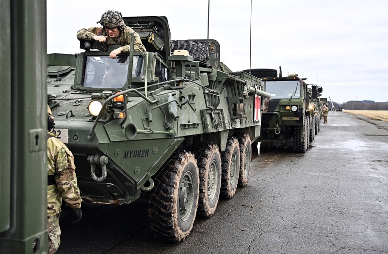 UKRAINE-CRISIS/GERMANY-USA TROOPS A soldier of the U.S. 2nd Cavalry Regiment stands in a combat vehicle as gear is prepared for deployment to Romania at Rose Barracks in Vilseck, Germany, February 9, 2022. REUTERS/Lukas Barth