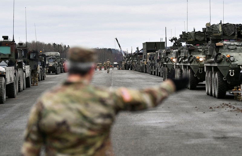 UKRAINE-CRISIS/GERMANY-USA TROOPS A soldier of the U.S. 2nd Cavalry Regiment stands in a combat vehicle as gear is prepared for deployment to Romania at Rose Barracks in Vilseck, Germany, February 9, 2022. REUTERS/Lukas Barth