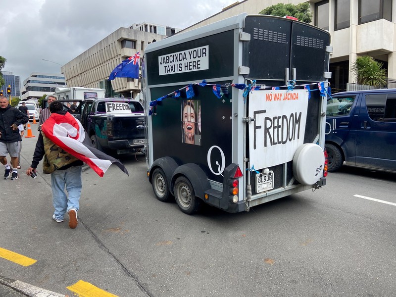 HEALTH-CORONAVIRUS/NEWZEALAND A vehicle with a picture of New Zealand's Prime Minister Jacinda Ardern is seen as Anti-vaccine mandate protesters gather to demonstrate in front of the parliament in Wellington, New Zealand, February 10, 2022. REUTERS/Praveen Menon