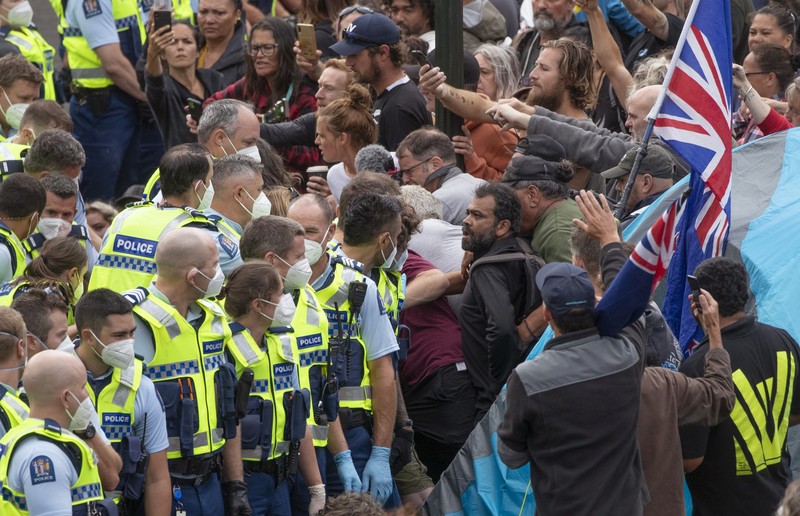 HEALTH-CORONAVIRUS/NEWZEALAND A vehicle with a picture of New Zealand's Prime Minister Jacinda Ardern is seen as Anti-vaccine mandate protesters gather to demonstrate in front of the parliament in Wellington, New Zealand, February 10, 2022. REUTERS/Praveen Menon