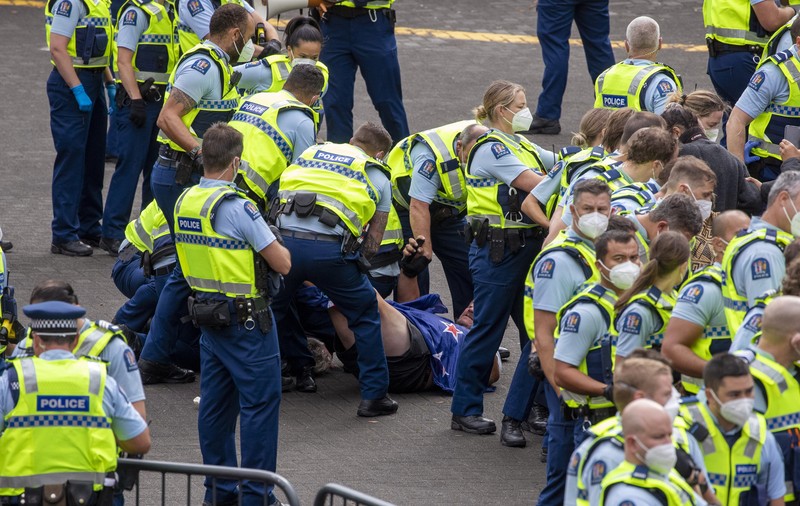 HEALTH-CORONAVIRUS/NEWZEALAND A vehicle with a picture of New Zealand's Prime Minister Jacinda Ardern is seen as Anti-vaccine mandate protesters gather to demonstrate in front of the parliament in Wellington, New Zealand, February 10, 2022. REUTERS/Praveen Menon