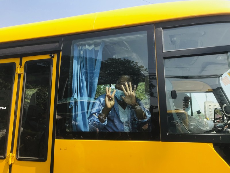 Myanmar Union Day A man gestures with his hands while onboard a bus with prisoners leaving Insein prison during the Union Day holiday in Yangon, Myanmar, Saturday, Feb. 12, 2022. In a customary gesture for national holidays, the head of Myanmar's military government, Senior General Min Aung Hlaing announced an amnesty Saturday covering more than 860 prisoners, state-run newspapers reported. (AP Photo)