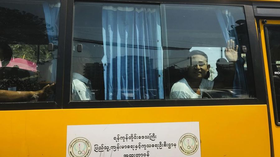 A man gestures with his hands while onboard a bus with prisoners leaving Insein prison during the Union Day holiday in Yangon, Myanmar, Saturday, Feb. 12, 2022. In a customary gesture for national holidays, the head of Myanmar's military government, Senior General Min Aung Hlaing announced an amnesty Saturday covering more than 860 prisoners, state-run newspapers reported. (AP Photo)