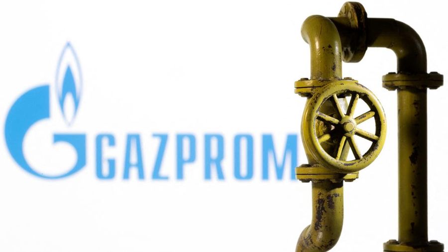 A 3D printed natural gas pipeline is placed in front of displayed Gazprom logo in this illustration taken February 8, 2022. REUTERS/Dado Ruvic/Illustration