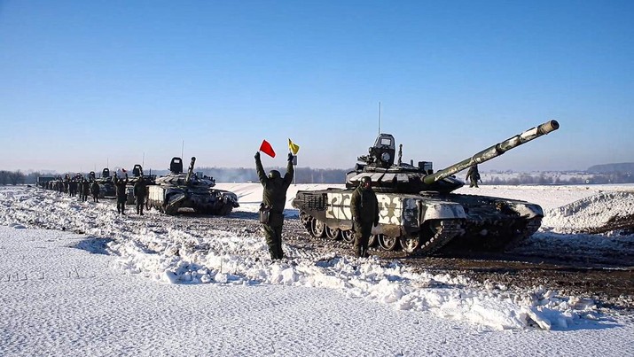 In this photo taken from video provided by the Russian Defense Ministry Press Service on Tuesday, Feb. 15, 2022, Russian army tanks stand ready to move back to their permanent base after drills in Russia. In what could be another sign that the Kremlin would like to lower the temperature, Russia's Defense Ministry announced Tuesday that some units participating in military exercises would begin returning to their bases. (Russian Defense Ministry Press Service via AP)