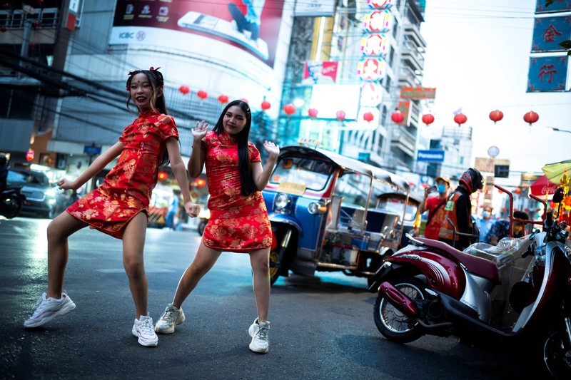 A motor-tricycle, or Tuk Tuk drives past Grand Palace in Bangkok, Thailand on Aug. 3, 2021. As Thailand battles a punishing COVID-19 surge with nearly 20,000 new cases every day, people who depend on tourism struggle in what was one of the most-visited cities in the world, with 20 million visitors in the year before the pandemic. (AP Photo/Sakchai Lalit)