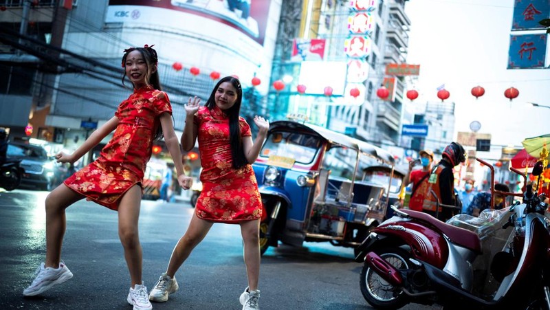 A motor-tricycle, or Tuk Tuk drives past Grand Palace in Bangkok, Thailand on Aug. 3, 2021. As Thailand battles a punishing COVID-19 surge with nearly 20,000 new cases every day, people who depend on tourism struggle in what was one of the most-visited cities in the world, with 20 million visitors in the year before the pandemic. (AP Photo/Sakchai Lalit)