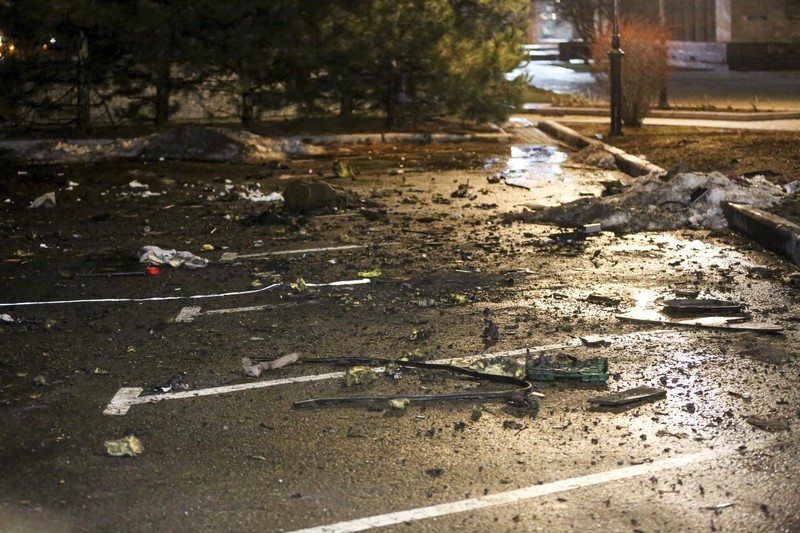 Debris from a blown up car, in Donetsk, the territory controlled by pro-Russian militants, eastern Ukraine, Friday, Feb. 18, 2022. Spiking tensions in eastern Ukraine on Friday aggravated Western fears of a Russian invasion and a new war in Europe, with a humanitarian convoy hit by shelling and pro-Russian rebels evacuating civilians from the conflict zone. A car bombing hit the eastern city of Donetsk, but no casualties were reported. (AP Photo/Alexei Alexandrov)