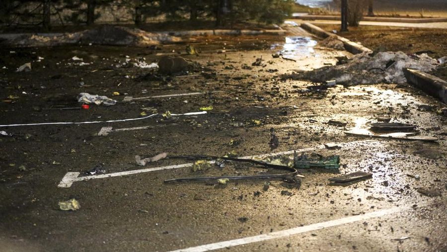 Debris from a blown up car, in Donetsk, the territory controlled by pro-Russian militants, eastern Ukraine, Friday, Feb. 18, 2022. Spiking tensions in eastern Ukraine on Friday aggravated Western fears of a Russian invasion and a new war in Europe, with a humanitarian convoy hit by shelling and pro-Russian rebels evacuating civilians from the conflict zone. A car bombing hit the eastern city of Donetsk, but no casualties were reported. (AP Photo/Alexei Alexandrov)