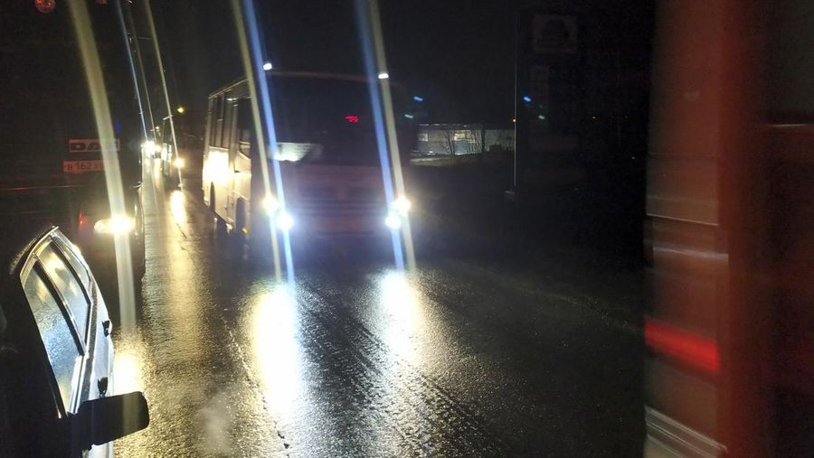 Column of buses carry evacuated people to Russia amid crisis in Donetsk, the territory controlled by pro-Russian militants, eastern Ukraine, Friday, Feb. 18, 2022. Spiking tensions in eastern Ukraine on Friday aggravated Western fears of a Russian invasion and a new war in Europe, with a humanitarian convoy hit by shelling and pro-Russian rebels evacuating civilians from the conflict zone. A car bombing hit the eastern city of Donetsk, but no casualties were reported. (AP Photo/Alexei Alexandrov)