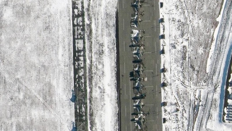 Debris from a blown up car, in Donetsk, the territory controlled by pro-Russian militants, eastern Ukraine, Friday, Feb. 18, 2022. Spiking tensions in eastern Ukraine on Friday aggravated Western fears of a Russian invasion and a new war in Europe, with a humanitarian convoy hit by shelling and pro-Russian rebels evacuating civilians from the conflict zone. A car bombing hit the eastern city of Donetsk, but no casualties were reported. (AP Photo/Alexei Alexandrov)