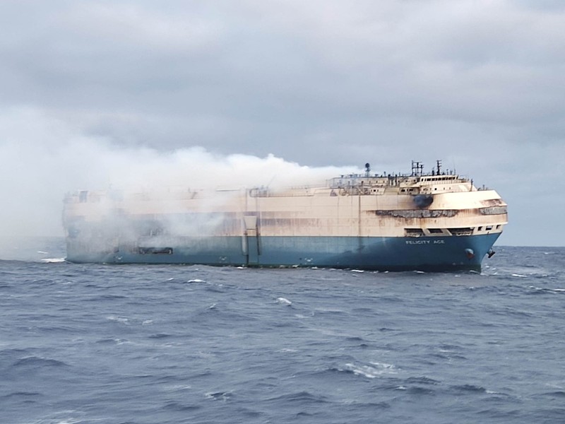 The ship, Felicity Ace, which was traveling from Emden, Germany, where Volkswagen has a factory, to Davisville, in the U.S. state of Rhode Island, burns more than 100 km from the Azores islands, Portugal, February 18, 2022. Portuguese Navy (Marinha Portuguesa)/Handout via REUTERS THIS IMAGE HAS BEEN SUPPLIED BY A THIRD PARTY.