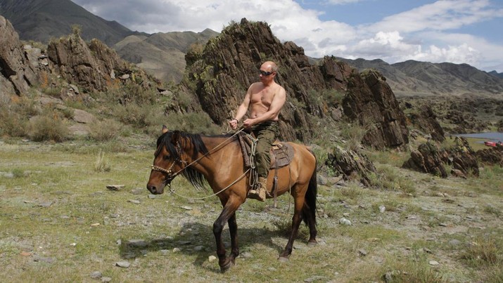 FILE - In this file pool photo taken on Monday, Aug. 3, 2009, the then Russian Prime Minister Vladimir Putin ia seen riding a horse while traveling in the mountains of the Siberian Tyva region (also referred to as Tuva), Russia, during his short vacation. After 18 years as Russia’s leader _ and with another six-year term sure to follow a March election _ Putin doesn’t show the appetites or vulnerabilities that can personalize Western politics, even when staged or spun. If he has moments of merriment or melancholy, they happen in private. (Alexei Druzhinin, Sputnik, Kremlin Pool Photo via AP, file)