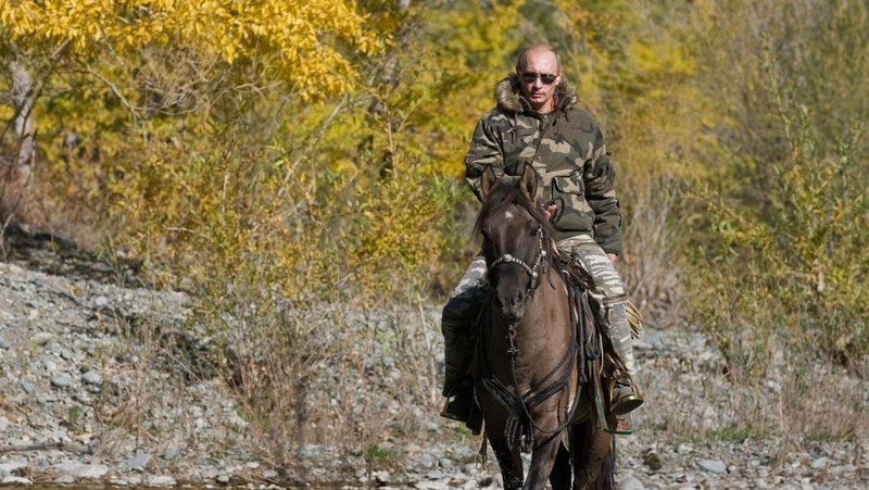 FILE - In this file pool photo taken on Monday, Aug. 3, 2009, the then Russian Prime Minister Vladimir Putin ia seen riding a horse while traveling in the mountains of the Siberian Tyva region (also referred to as Tuva), Russia, during his short vacation. After 18 years as Russia’s leader _ and with another six-year term sure to follow a March election _ Putin doesn’t show the appetites or vulnerabilities that can personalize Western politics, even when staged or spun. If he has moments of merriment or melancholy, they happen in private. (Alexei Druzhinin, Sputnik, Kremlin Pool Photo via AP, file)