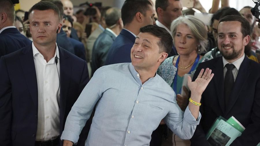 FILE - In this Friday, March 29, 2019 file photo, Volodymyr Zelenskiy, Ukrainian actor and candidate in the upcoming presidential election, hosts a comedy show at a concert hall in Brovary, Ukraine. For his presidential campaign popular Ukrainian comedian Volodymyr Zelenskiy has literally taken the script from a TV show in which he plays the Ukrainian president. (AP Photo/Efrem Lukatsky, file)