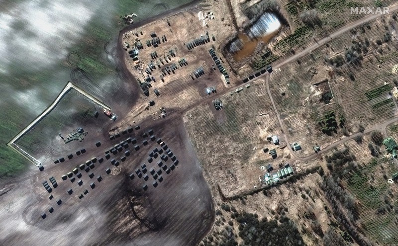 Ukraine Russia War This satellite image provided by Maxar Technologies shows part of military convoy and burning homes northwest of Invankiv, Ukraine Monday, Feb. 28, 2022. (Satellite image ©2022 Maxar Technologies via AP)