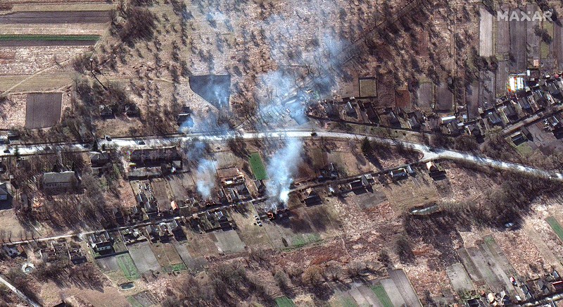 Ukraine Russia War This satellite image provided by Maxar Technologies shows part of military convoy and burning homes northwest of Invankiv, Ukraine Monday, Feb. 28, 2022. (Satellite image ©2022 Maxar Technologies via AP)