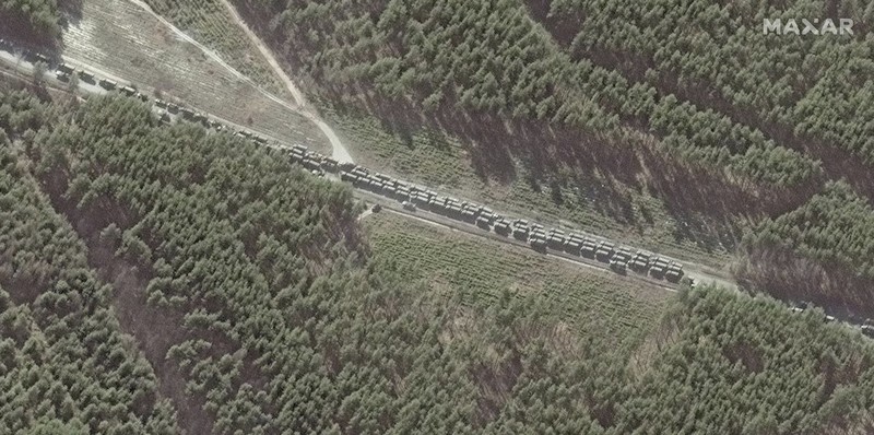 Ukraine Russia War This satellite image provided by Maxar Technologies shows part of military convoy and burning homes northwest of Invankiv, Ukraine Monday, Feb. 28, 2022. (Satellite image ©2022 Maxar Technologies via AP)