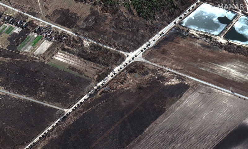 Ukraine Russia War This satellite image provided by Maxar Technologies shows part of military convoy and burning homes northwest of Invankiv, Ukraine Monday, Feb. 28, 2022. (Satellite image ©2022 Maxar Technologies via AP)