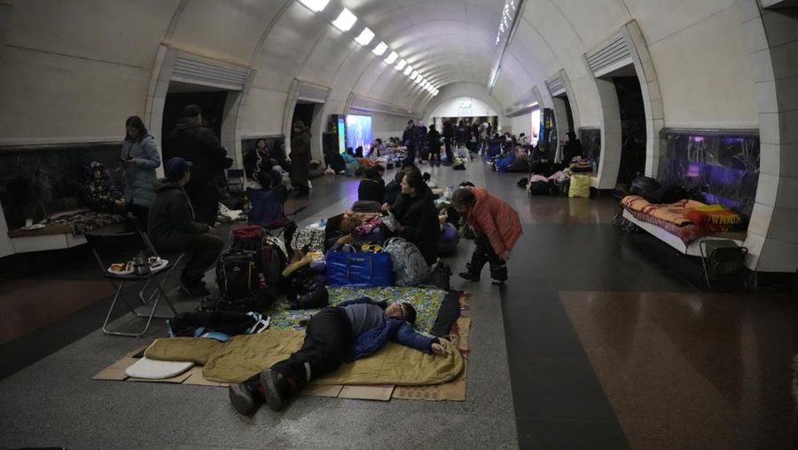 People gather in the Kyiv subway, using it as a bomb shelter in Kyiv, Ukraine, Wednesday, March 2, 2022. Russian forces have escalated their attacks on crowded cities in what Ukraine's leader called a blatant campaign of terror. (AP Photo/Efrem Lukatsky)