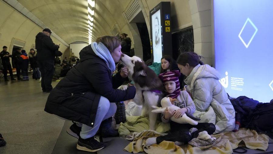 People gather in the Kyiv subway, using it as a bomb shelter in Kyiv, Ukraine, Wednesday, March 2, 2022. Russian forces have escalated their attacks on crowded cities in what Ukraine's leader called a blatant campaign of terror. (AP Photo/Efrem Lukatsky)