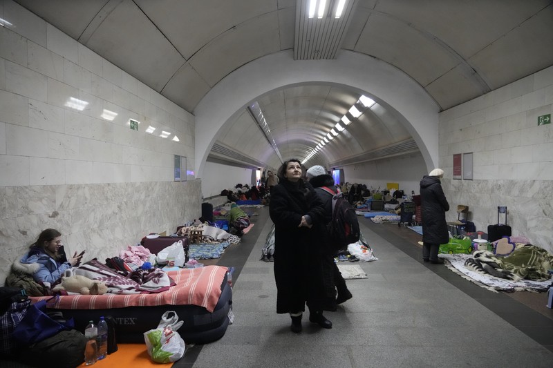 Russia Ukraine War People gather in the Kyiv subway, using it as a bomb shelter in Kyiv, Ukraine, Wednesday, March 2, 2022. Russian forces have escalated their attacks on crowded cities in what Ukraine's leader called a blatant campaign of terror. (AP Photo/Efrem Lukatsky)