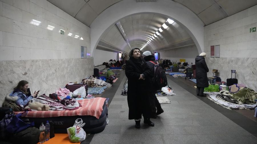 People gather in the Kyiv subway, using it as a bomb shelter in Kyiv, Ukraine, Wednesday, March 2, 2022. Russian forces have escalated their attacks on crowded cities in what Ukraine's leader called a blatant campaign of terror. (AP Photo/Efrem Lukatsky)