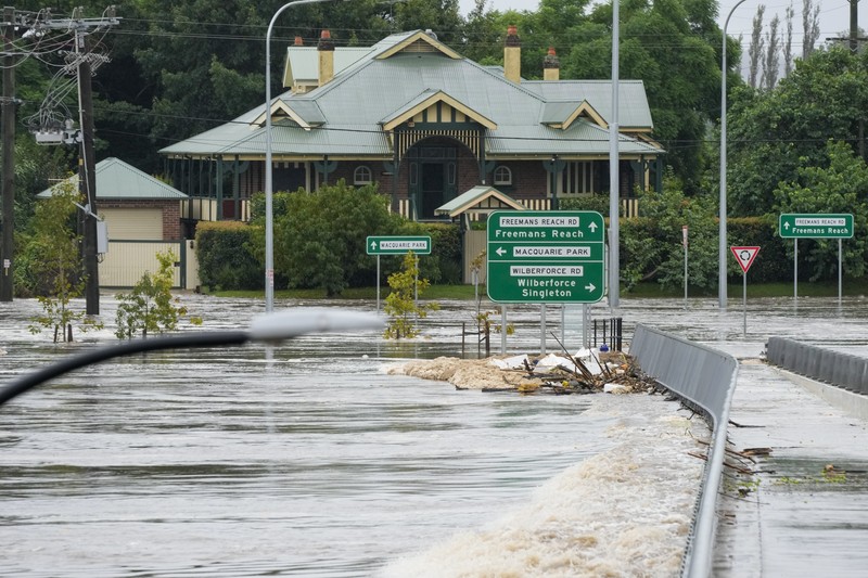 Australia Floods A building is submerged in flood waters near Windsor on the outskirts of Sydney, Australia, Thursday, March 3, 2022.Tens of thousands of people had been ordered to evacuate their homes and many more had been told to prepare to flee as parts of Australia's southeast coast are inundated by the worst flooding in decades. (AP Photo/Rick Rycroft)