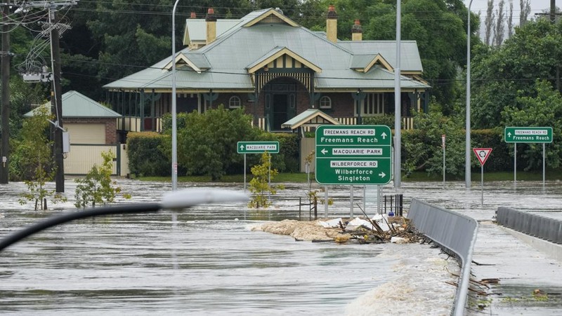 A building is submerged in flood waters near Windsor on the outskirts of Sydney, Australia, Thursday, March 3, 2022.Tens of thousands of people had been ordered to evacuate their homes and many more had been told to prepare to flee as parts of Australia's southeast coast are inundated by the worst flooding in decades. (AP Photo/Rick Rycroft)