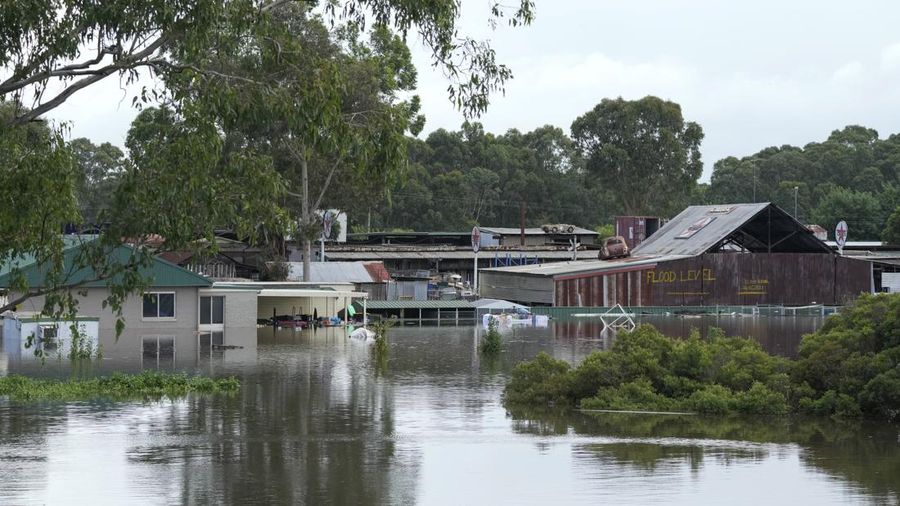A building is submerged in flood waters near Windsor on the outskirts of Sydney, Australia, Thursday, March 3, 2022.Tens of thousands of people had been ordered to evacuate their homes and many more had been told to prepare to flee as parts of Australia's southeast coast are inundated by the worst flooding in decades. (AP Photo/Rick Rycroft)