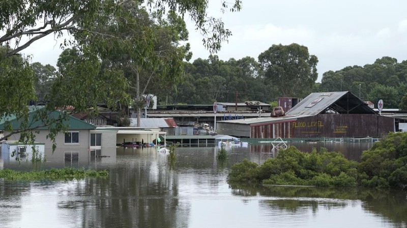 A building is submerged in flood waters near Windsor on the outskirts of Sydney, Australia, Thursday, March 3, 2022.Tens of thousands of people had been ordered to evacuate their homes and many more had been told to prepare to flee as parts of Australia's southeast coast are inundated by the worst flooding in decades. (AP Photo/Rick Rycroft)