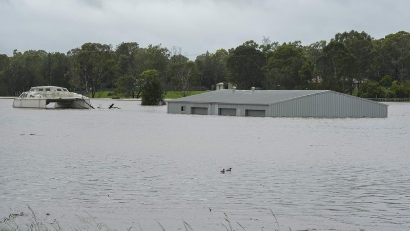 A building is submerged in flood waters near Windsor on the outskirts of Sydney, Australia, Thursday, March 3, 2022.Tens of thousands of people had been ordered to evacuate their homes and many more had been told to prepare to flee as parts of Australia's southeast coast are inundated by the worst flooding in decades. (AP Photo/Rick Rycroft)