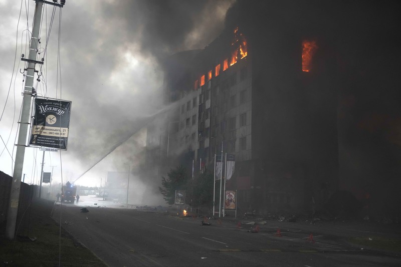 A building burns after shelling in Kyiv, Ukraine, Thursday, March 3, 2022. Russian forces have escalated their attacks on crowded cities in what Ukraine's leader called a blatant campaign of terror. (AP Photo/Efrem Lukatsky)